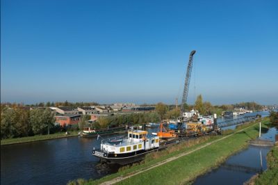 Dijkstabilisatie met gebruik van een zandsproeimethode
